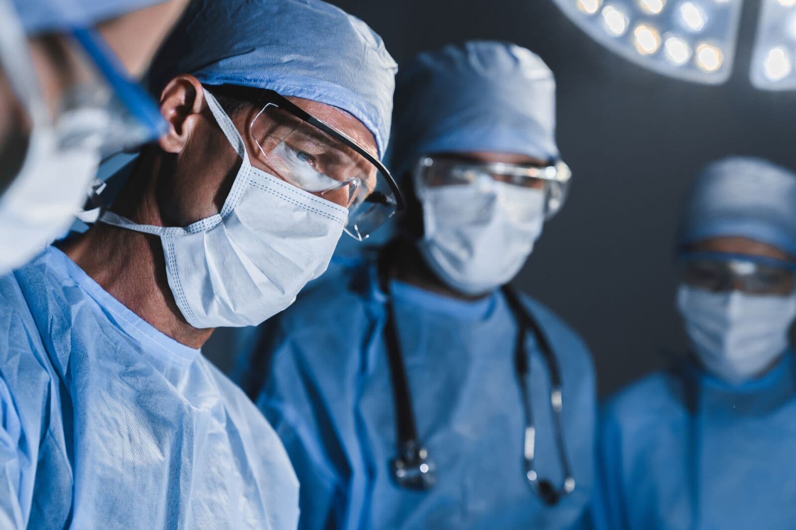Medical specialists operating in a modern surgical suite