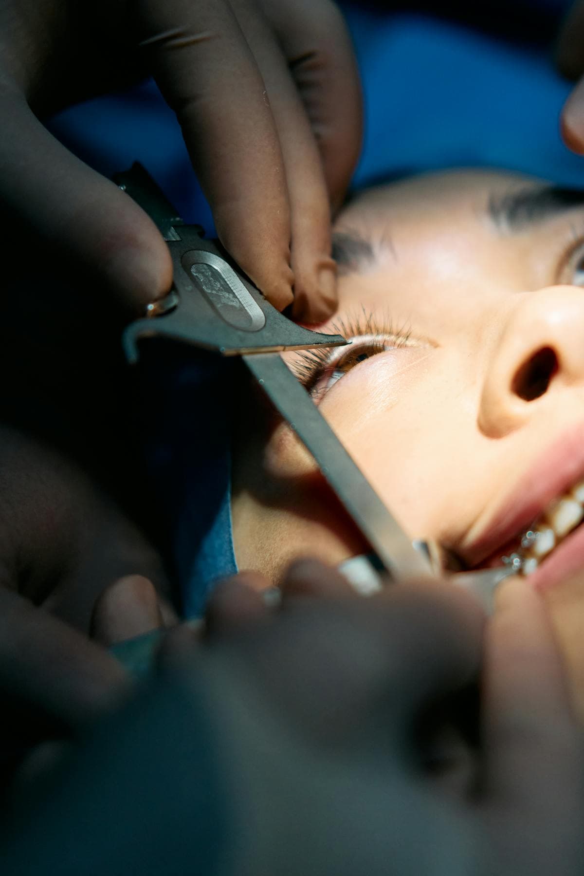 Ophthalmic surgeon at the operating microscope, cinematic studio portrait